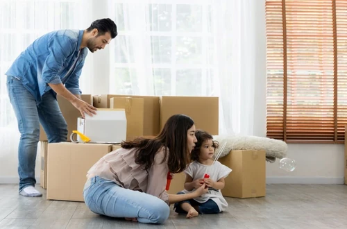 A family packing up their house while getting ready to move.